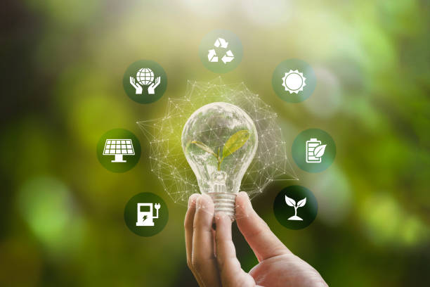 Hand holding and glowing light bulb